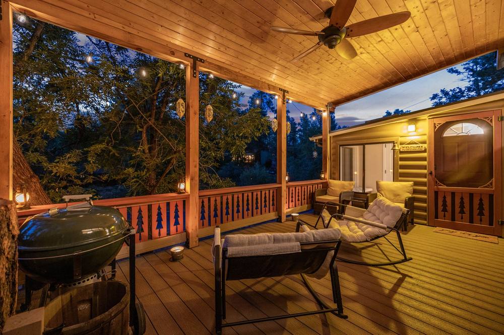 Balcony deck at twilight with string lights
