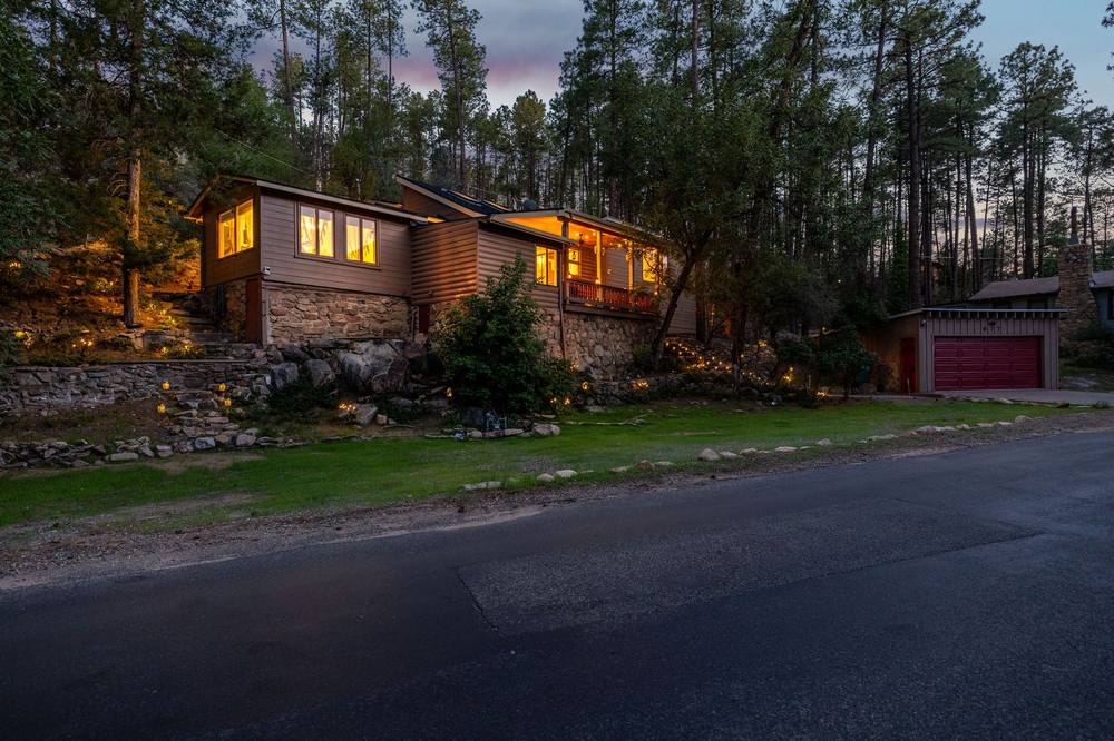 Front of the house glowing at twilight